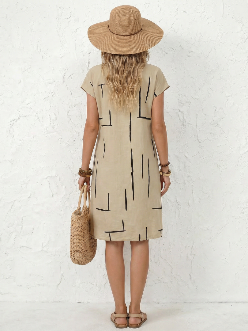 Damska sukienka do kolan z abstrakcyjnym nadrukiem i krótkim rękawem
