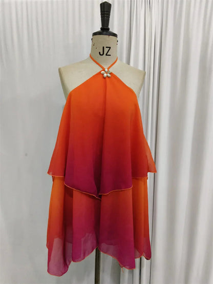 Elegancka różowa mini sukienka z falbanami i efektem gradientu