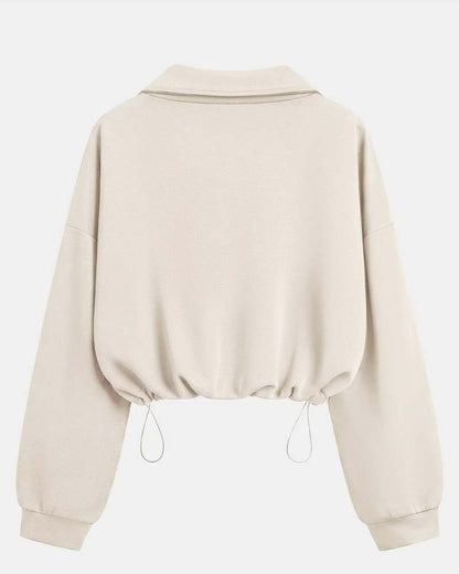 Zbliżenie na zamek i materiał bluzy z mieszanki bawełny