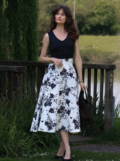 Wintage sukienka koktajlowa trapezowa w stylu pin-up z kwiatowym wzorem z lat 50.
