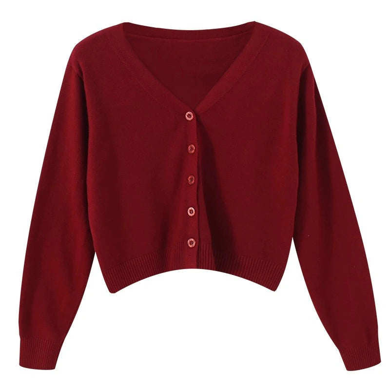 Krótki sweter damski z dzianiny z dekoltem w serek