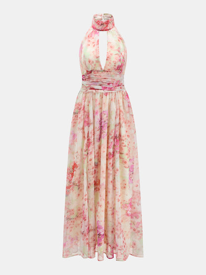 Damska zwiewna sukienka maxi w kwiaty z dekoltem halter na modelce