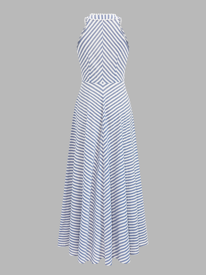 Modelka w damskiej sukience midi w paski z dekoltem halter