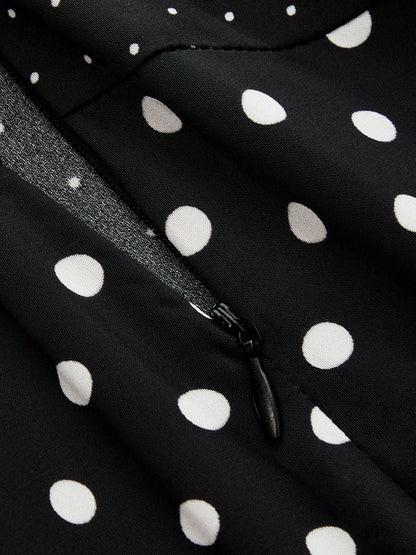 Elegancka spódnica midi w groszki z koronką - lekki fason do stylizacji codziennych i wyjściowych