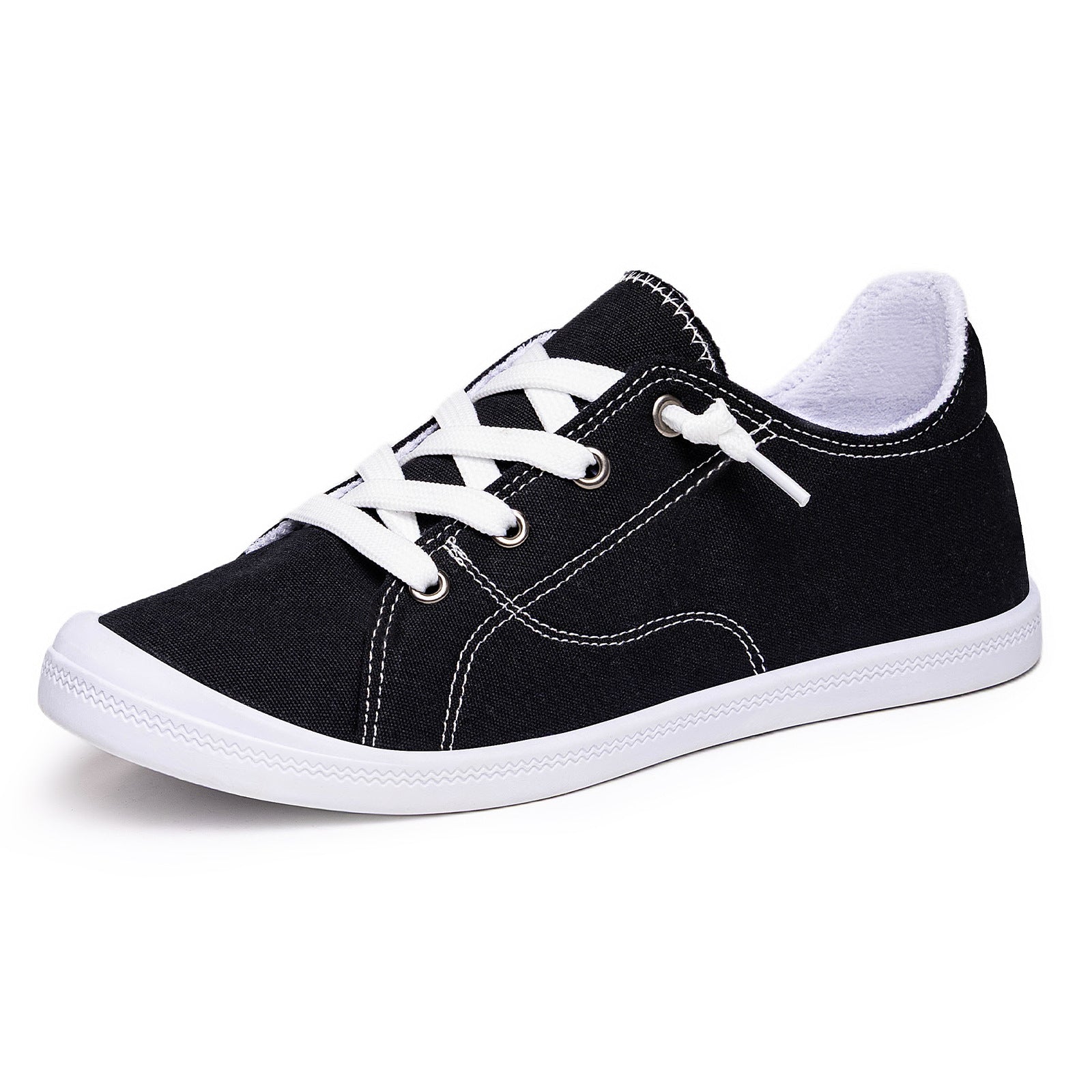 Zbliżenie na niską cholewkę damskich sneakersów canvas