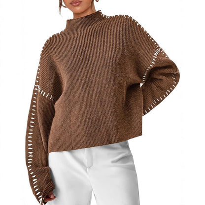 Pełna sylwetka w damskim swetrze oversize