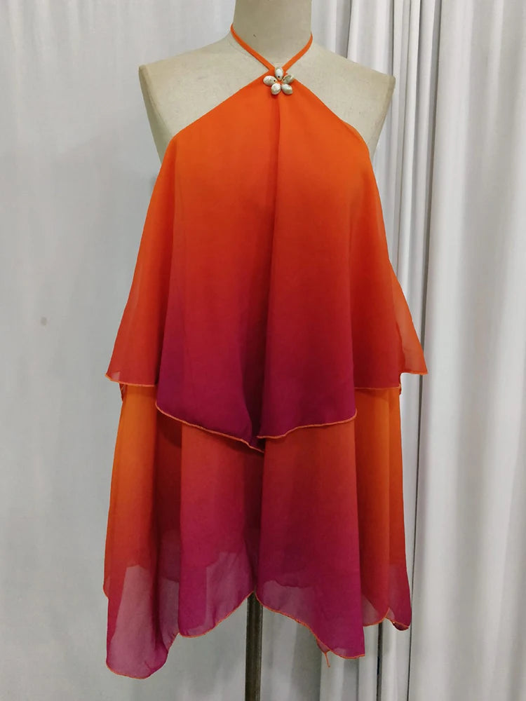 Elegancka różowa mini sukienka z falbanami i efektem gradientu