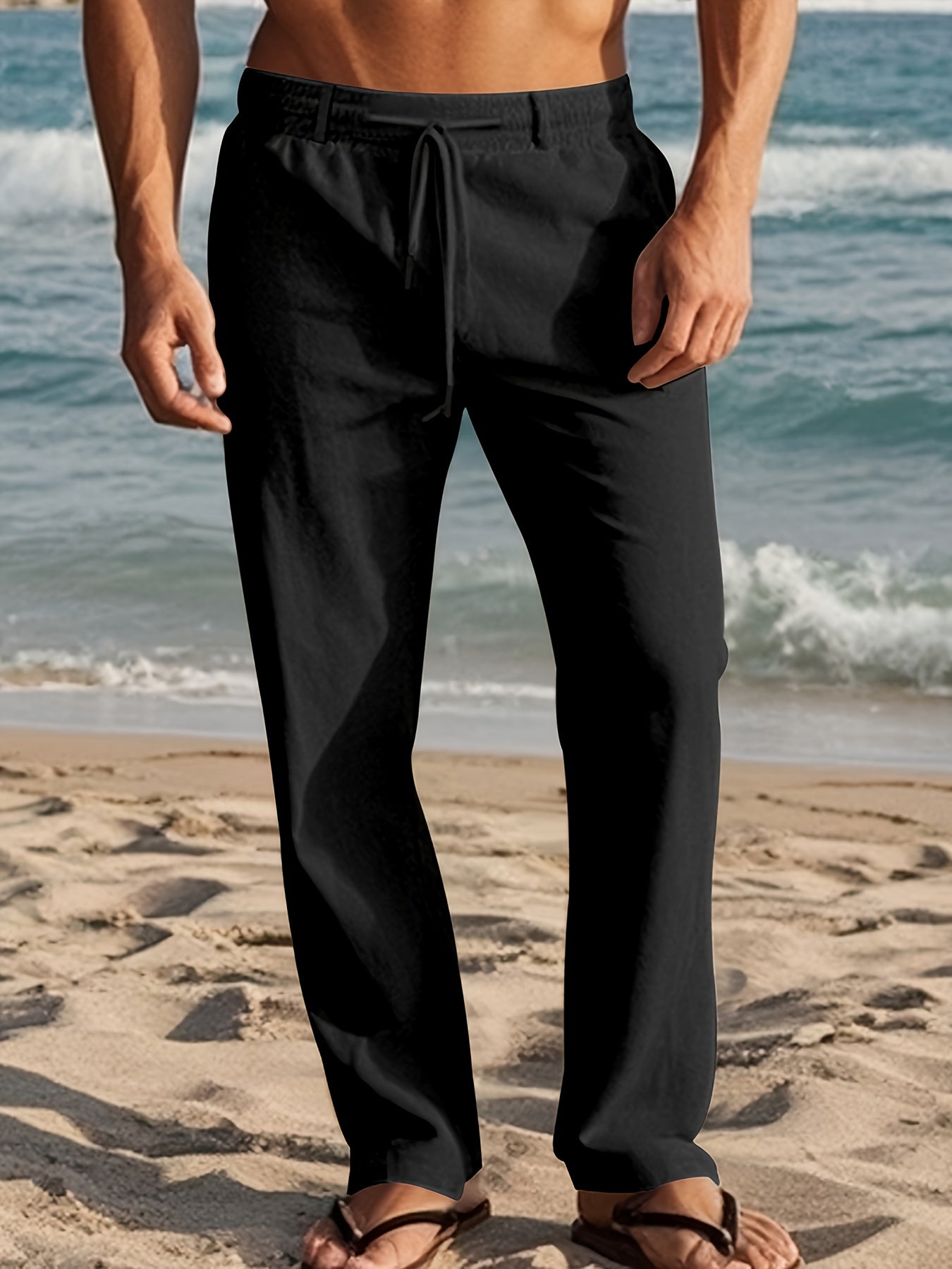 Męskie spodnie lniane relaxed fit na modelu, ujęcie z boku