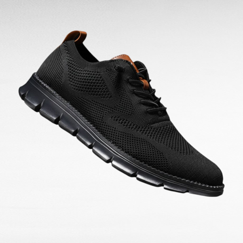 Detal dzianinowej cholewki i sznurowania męskich sneakersów